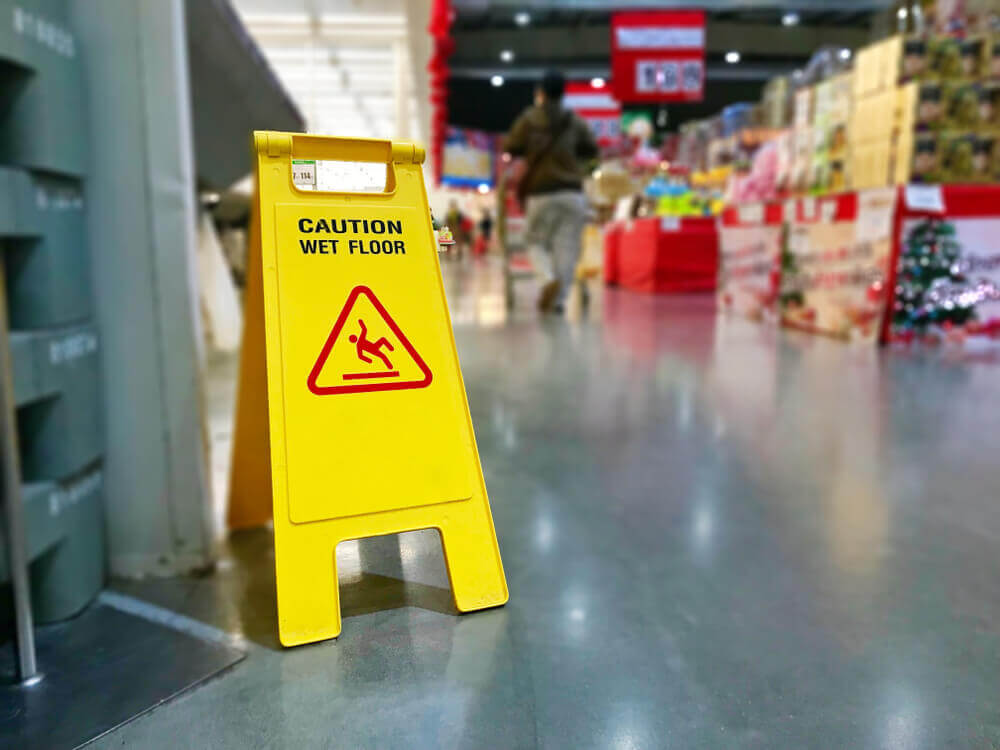 Caution sign of slippery floor in the grocery